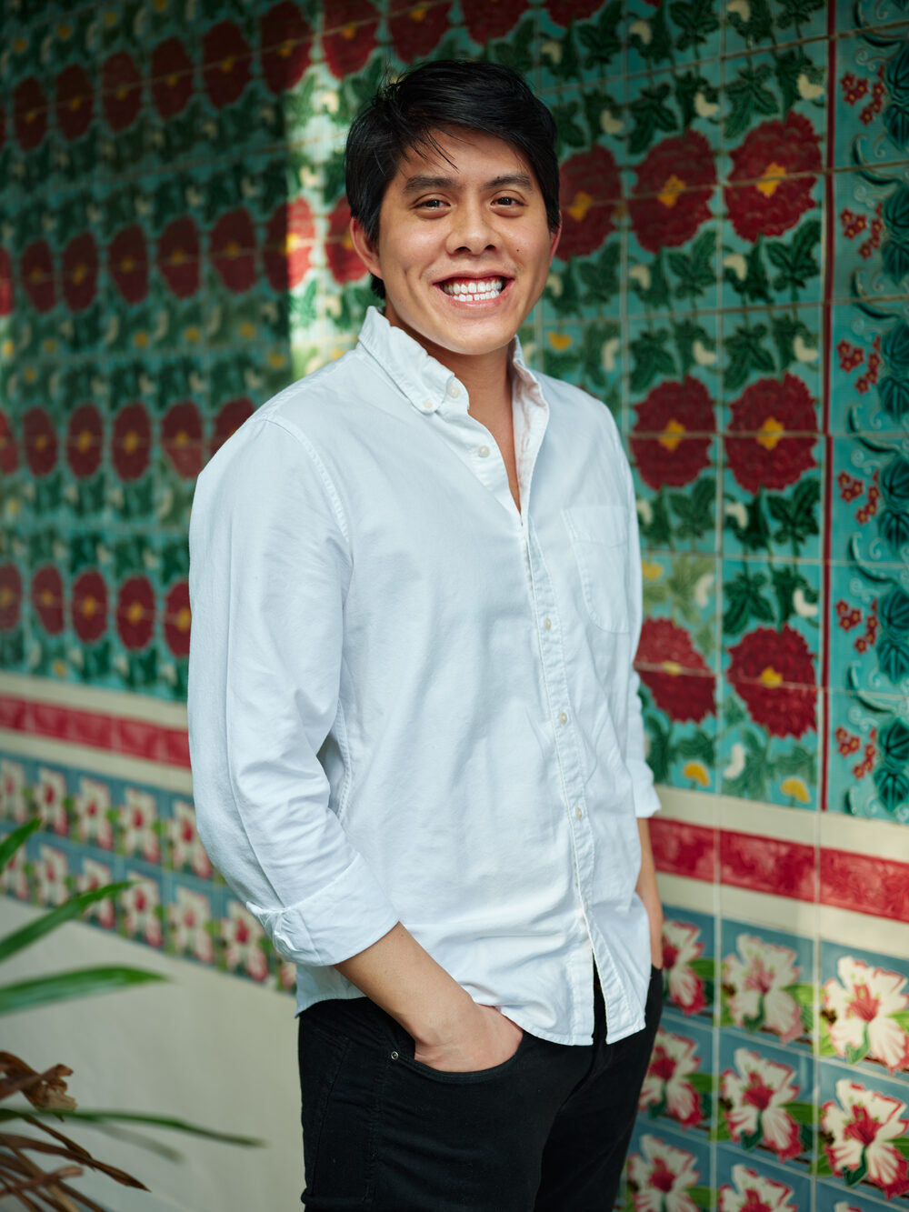 Fang Low, founder of Figment and The Straits Museum, photographed against the Peranakan tiles of a Singapore shophouse